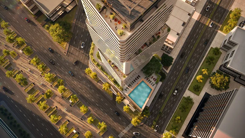 Aerial view of the tower and pool deck at the street corner — Cube Metropol, Batumi