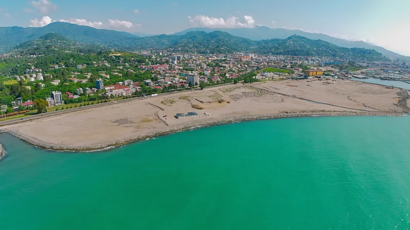 The coastline at the island site, drone view — Tonino Lamborghini Tower, Batumi