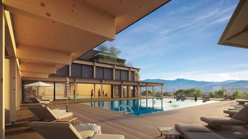 Outdoor pool with loungers and hills behind — Silk Towers, Batumi
