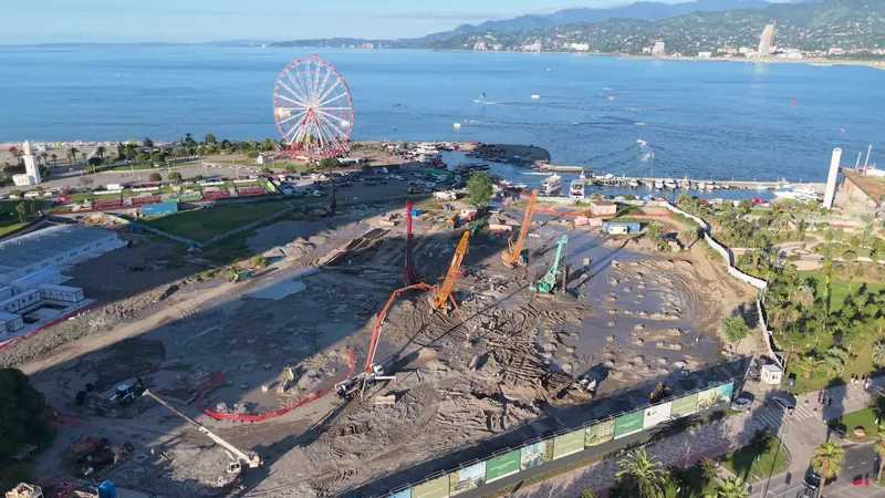 Construction site, drone view toward the sea — Silk Towers, Batumi