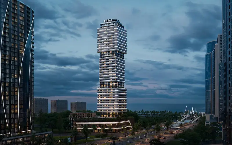 The tower at dusk between neighbouring towers — Cube Metropol, Batumi